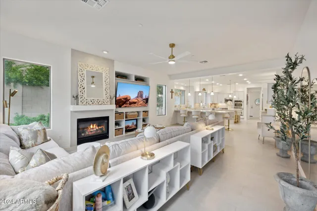 a spacious bedroom with a large bed and a large window