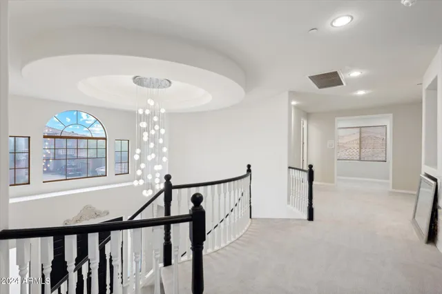 a bedroom with a bed and a flat tv screen