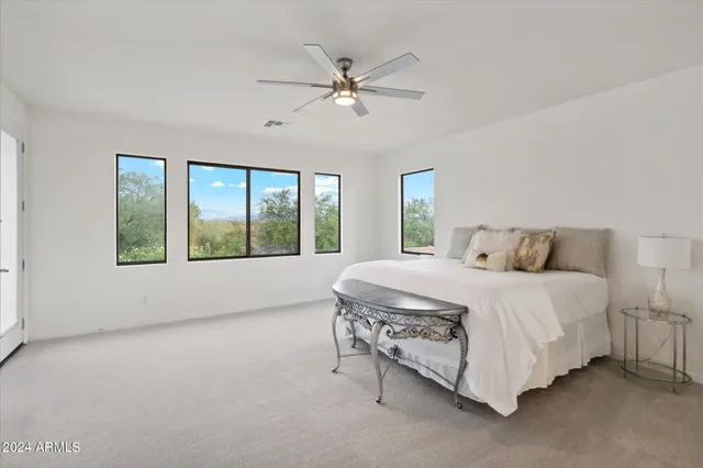 a living room with furniture window and a flat screen tv