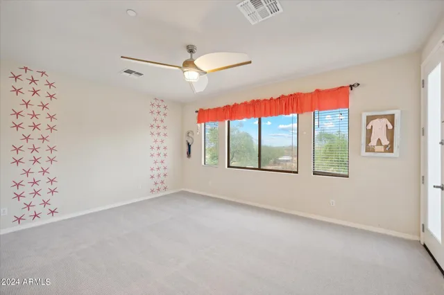a view of a patio with couches table and chairs and potted plants