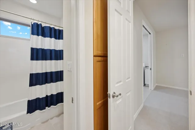 a view of a room with gym equipment and a large window