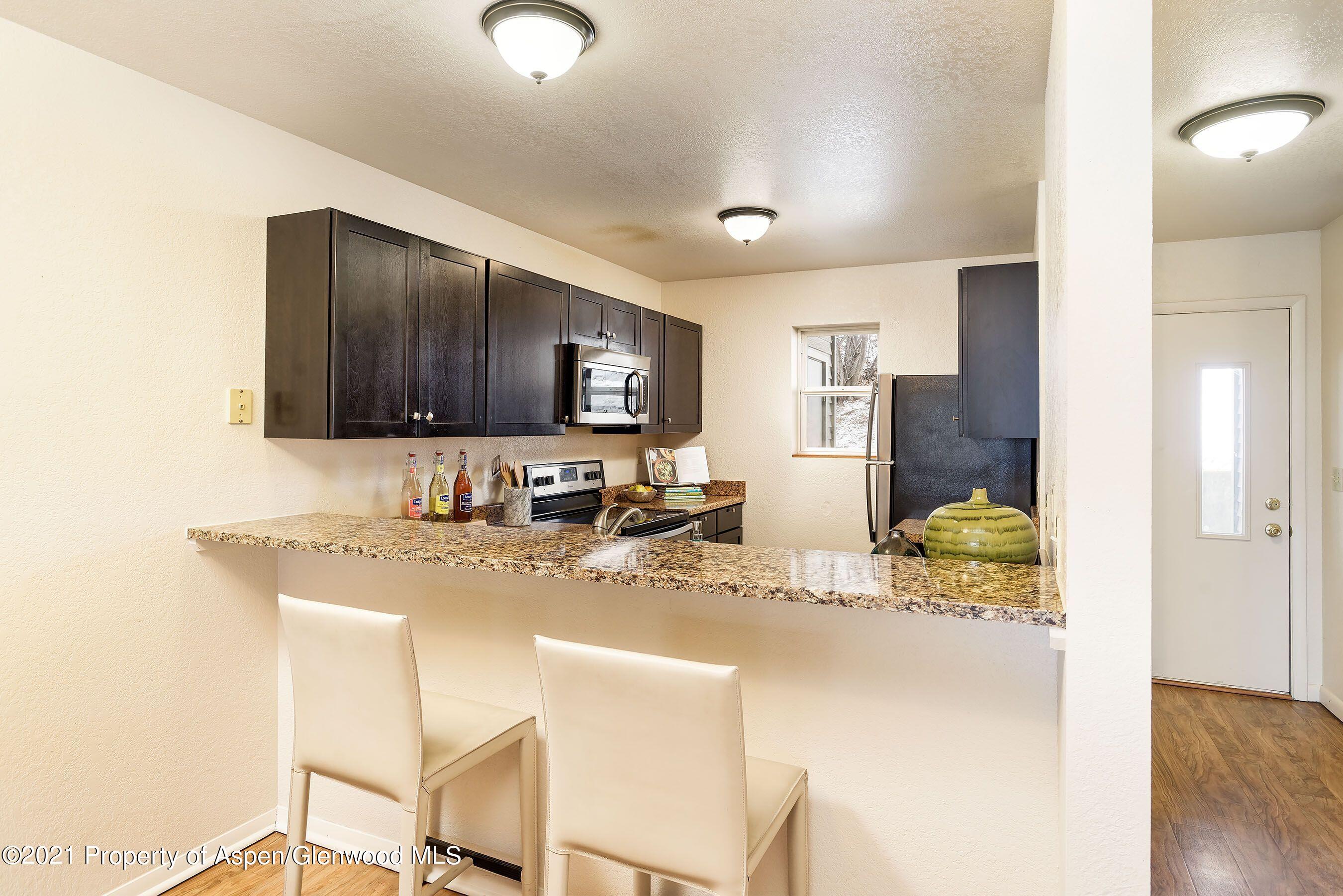 291 Park Avenue, Unit J4 Basalt, CO 81621 - Photo 11 of 12 291 kitchen staged