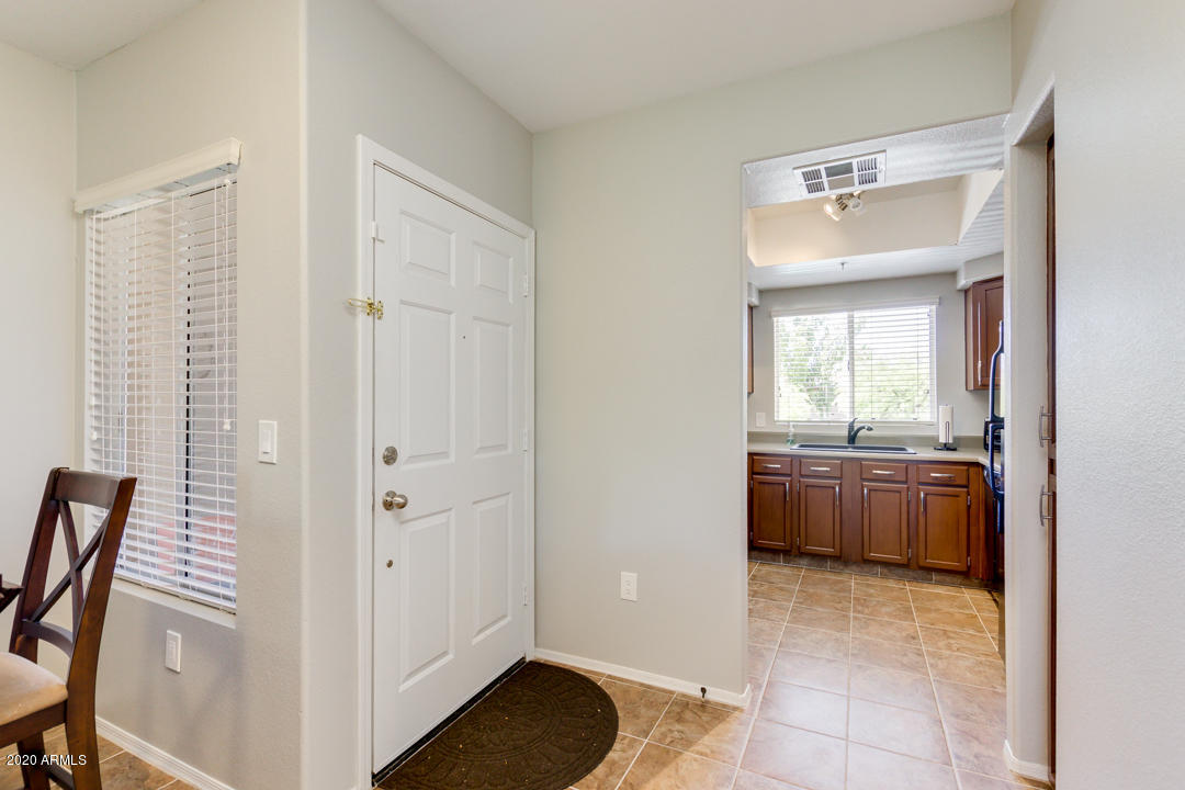 1825 West Ray Road, Unit 2107 Chandler, AZ 85224 - Photo 9 of 31 Front door and kitchen