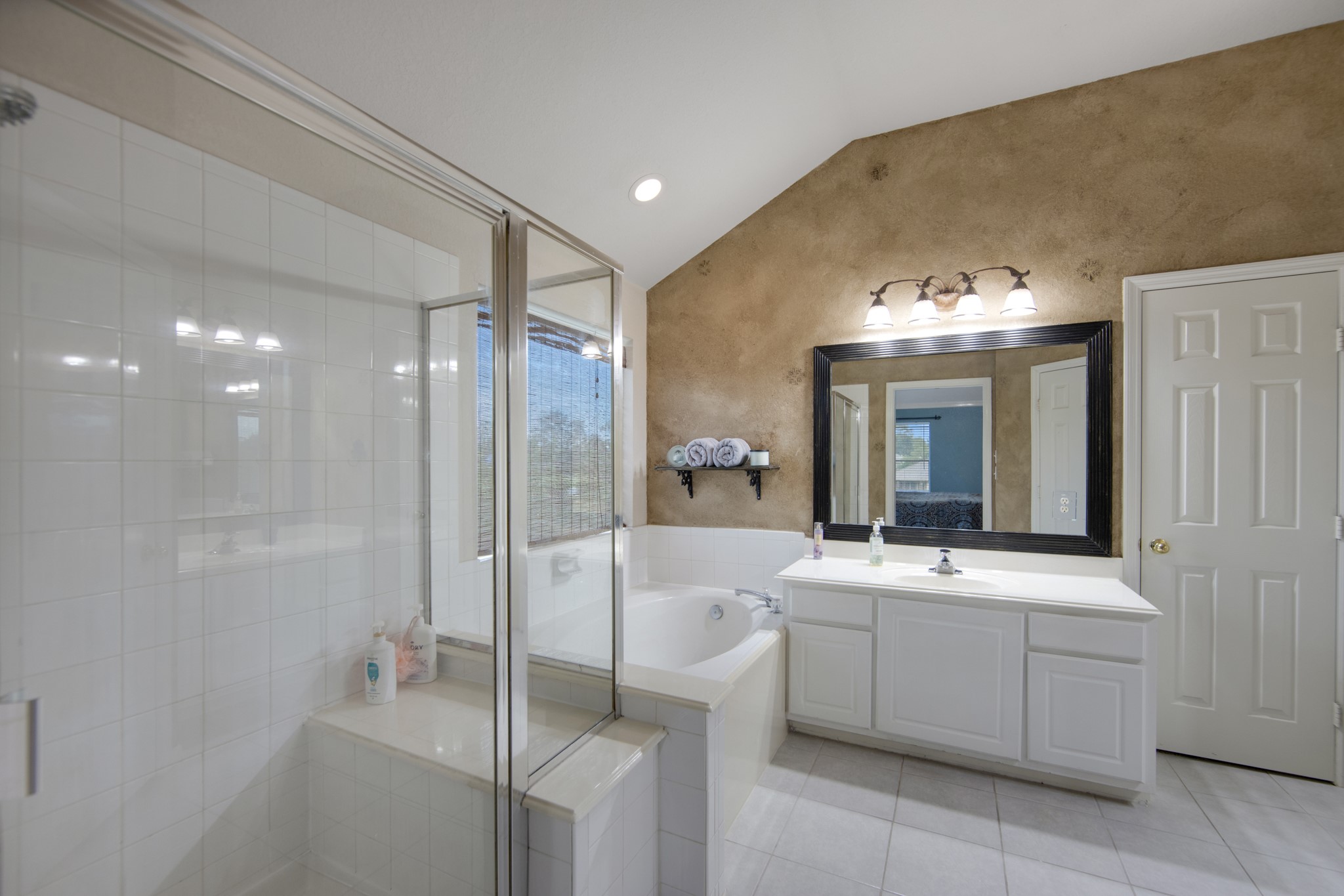 19414 Camellia Bend Circle Spring, TX 77379 - Photo 27 of 49 The elegant owners bathroom has a spacious glass shower with bench seat, garden tub, dual sinks, walk-in closet and private water closet