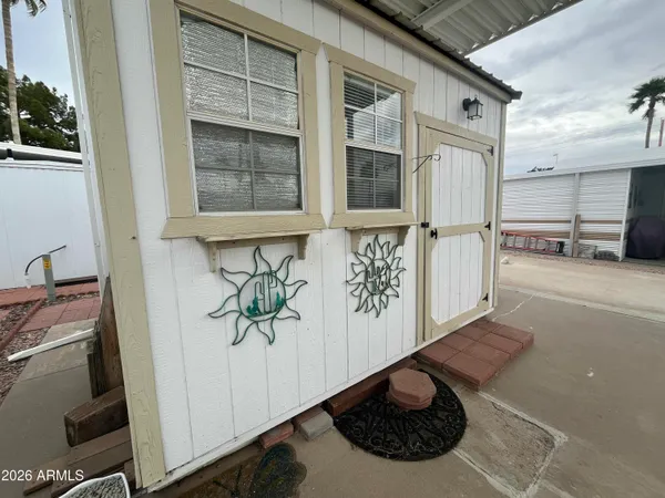 a living room with furniture and a ceiling fan