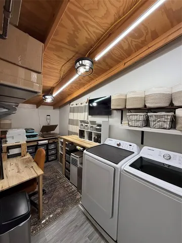 a utility room with dryer and washer