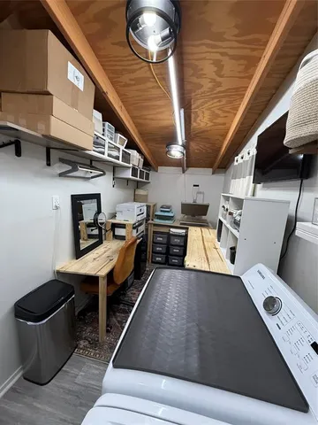 a view of kitchen with furniture and a potted plant
