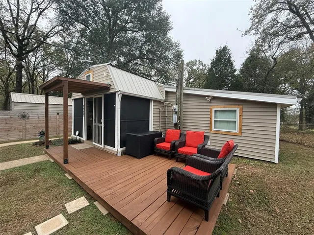 a backyard of a house with seating space