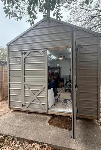 a view of a porch with a table and a chair