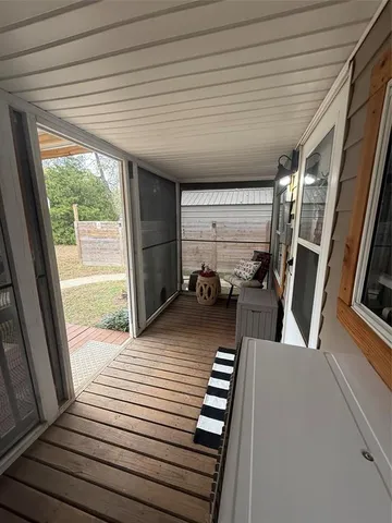 a view of a hardwood floor and staircase in a room