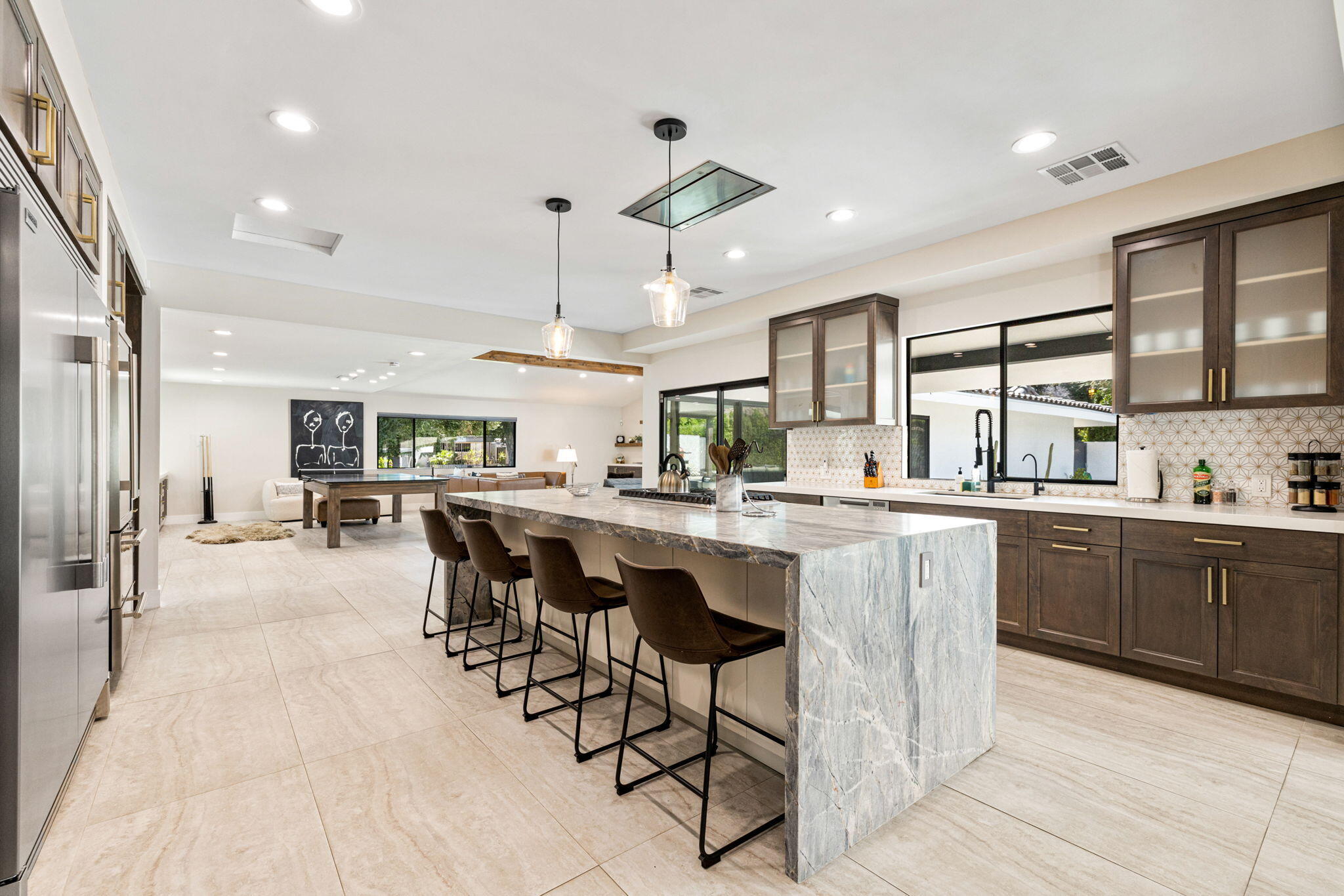 45655 Apache Road, Unit D Indian Wells, CA 92210 - Photo 13 of 31 a large kitchen with a table and chairs