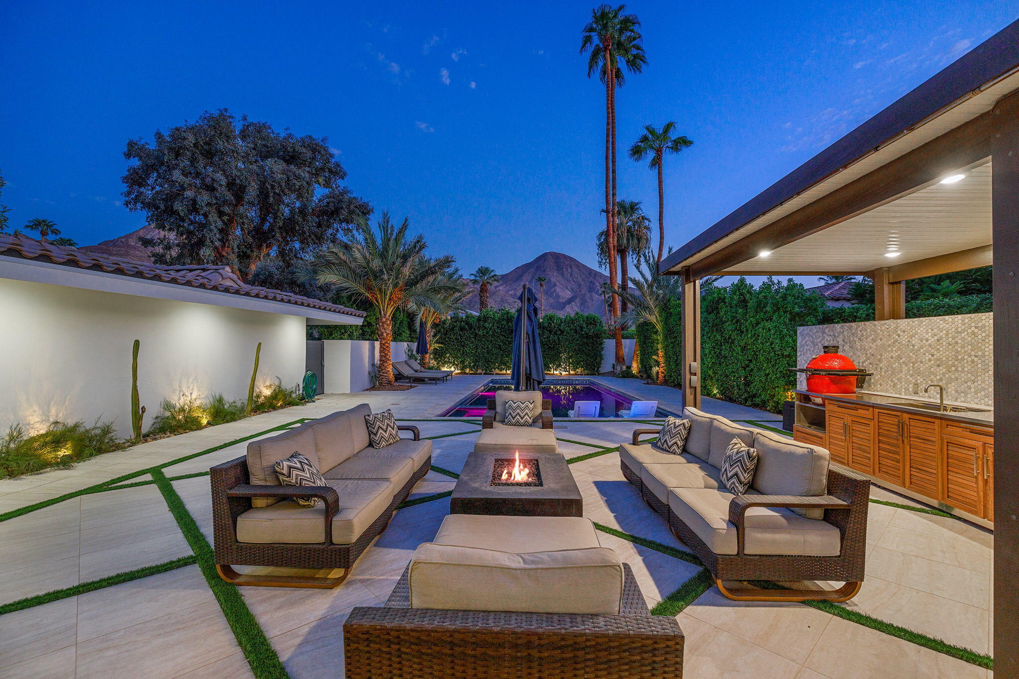 45655 Apache Road, Unit D Indian Wells, CA 92210 - Photo 2 of 31 a view of a patio with couches table and chairs with potted plants