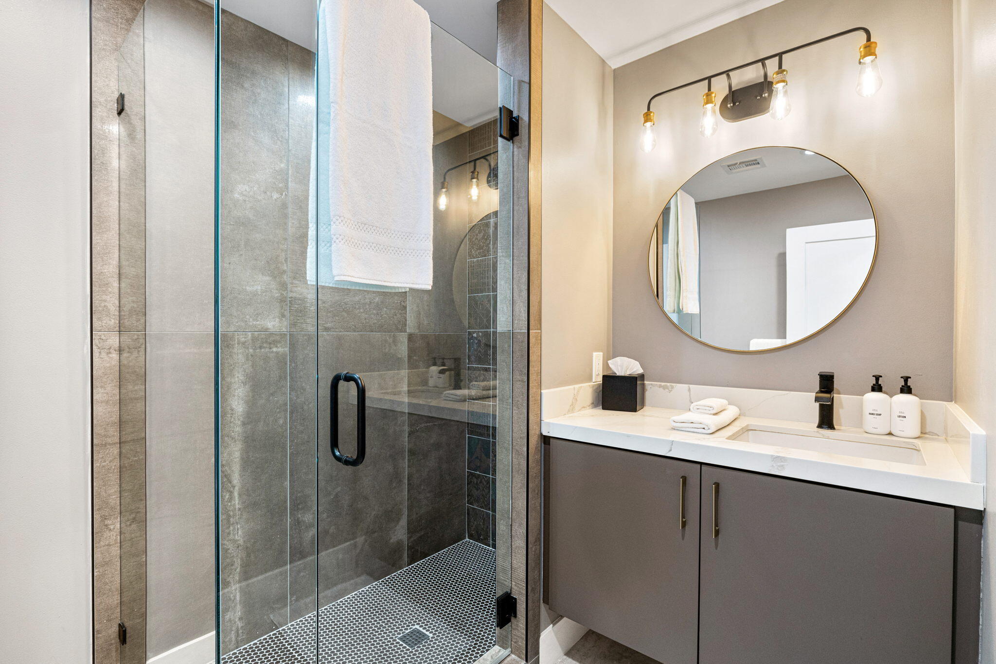 45655 Apache Road, Unit D Indian Wells, CA 92210 - Photo 24 of 31 a bathroom with a sink mirror and shower