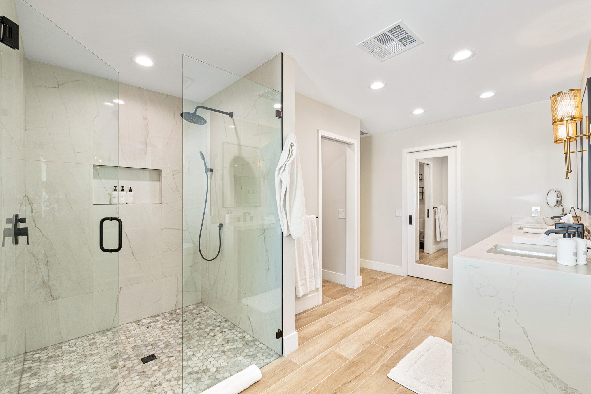 45655 Apache Road, Unit D Indian Wells, CA 92210 - Photo 27 of 31 a bathroom with a shower sink and mirror