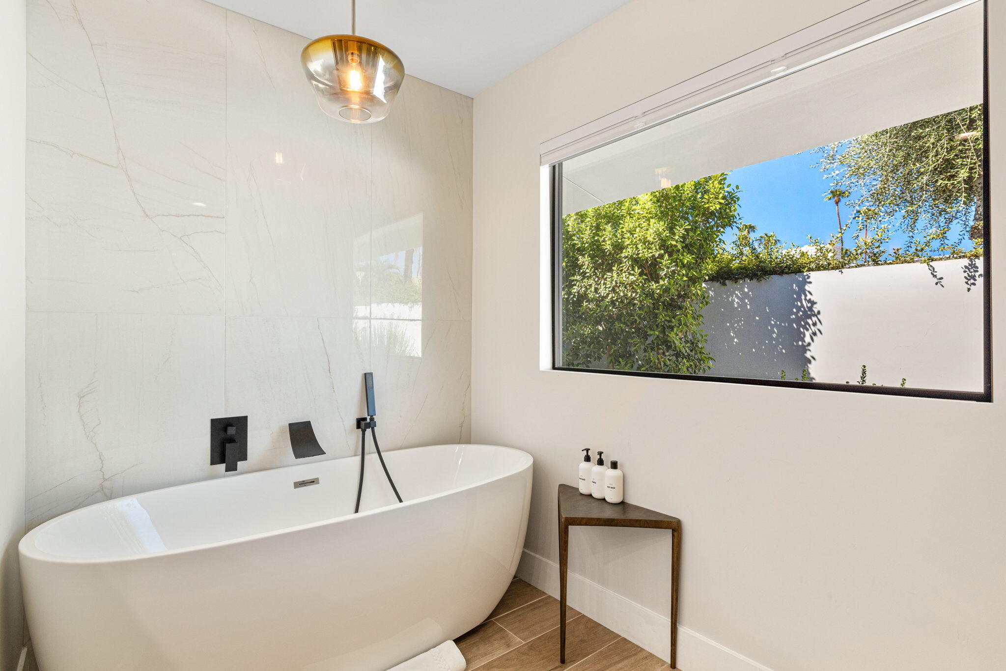 45655 Apache Road, Unit D Indian Wells, CA 92210 - Photo 28 of 31 a bathroom with a bathtub and a window