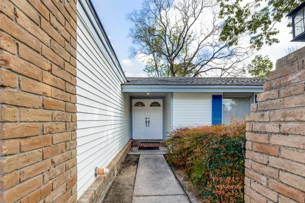 a front view of a house with garage
