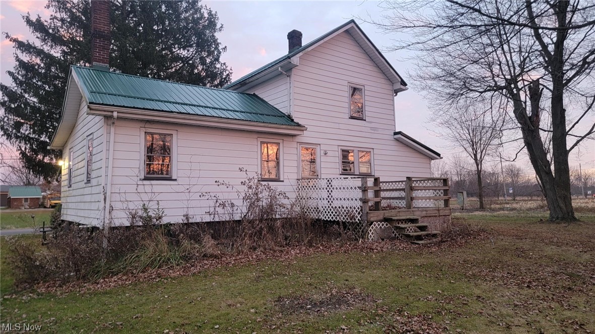 4360 South Bailey Road North Jackson, OH 44451 - Photo 2 of 6 Property exterior at dusk featuring a deck