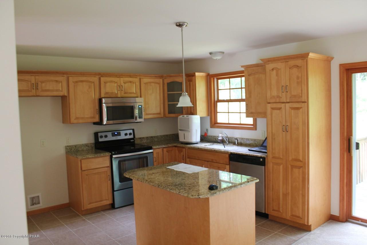 161 Granite Road Long Pond, PA 18334 - Photo 6 of 14 a kitchen that has a sink and a stove top oven