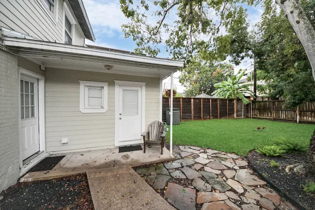 a side view of a house with garden