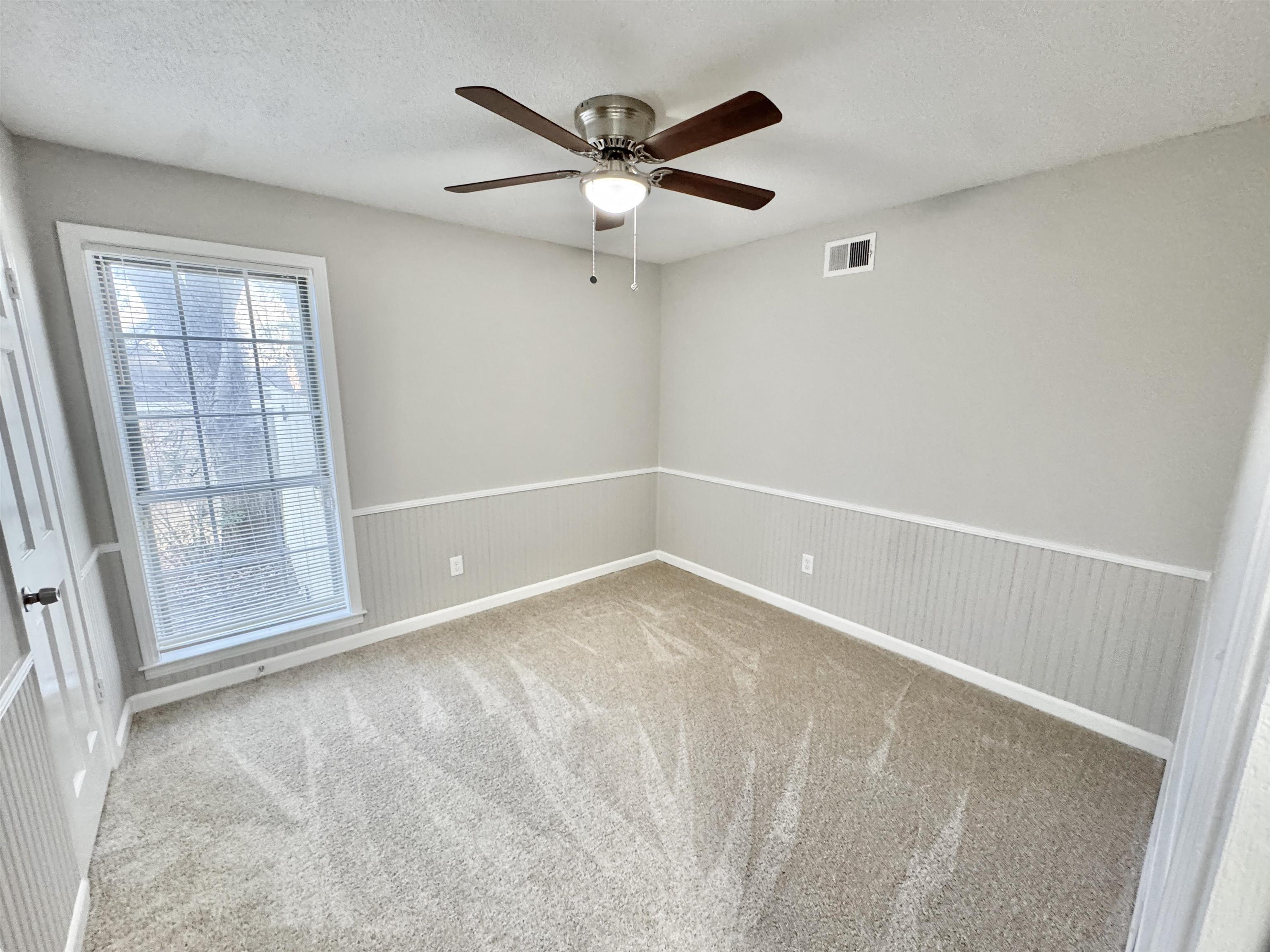 3334 Snow Ridge Cove Memphis, TN 38115 - Photo 16 of 38 an empty room with closet and windows