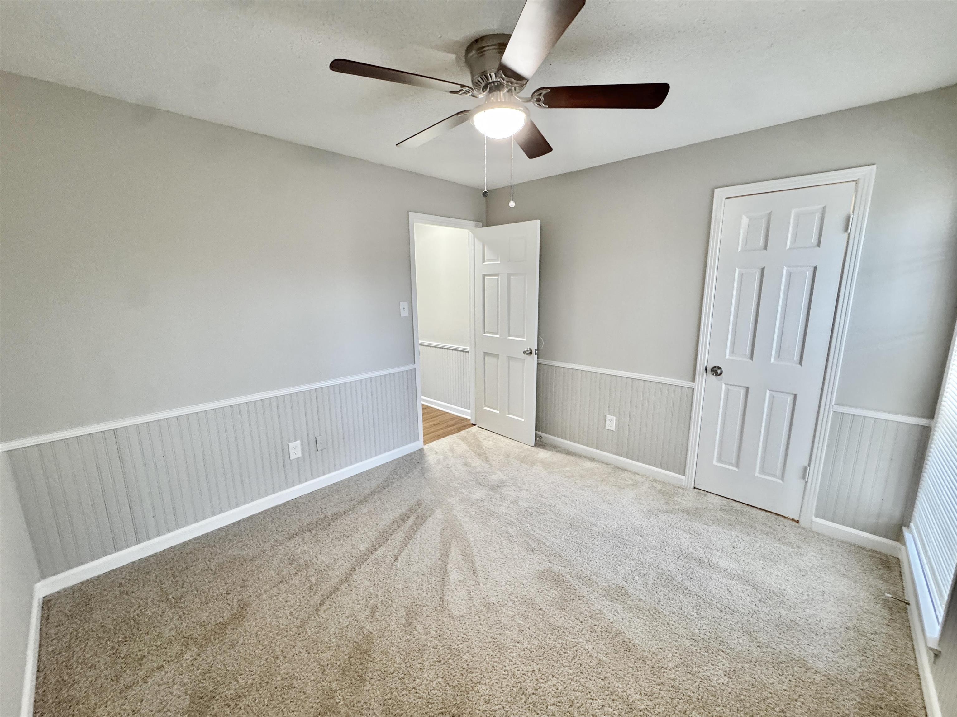 3334 Snow Ridge Cove Memphis, TN 38115 - Photo 18 of 38 a view of an empty room and chandelier fan