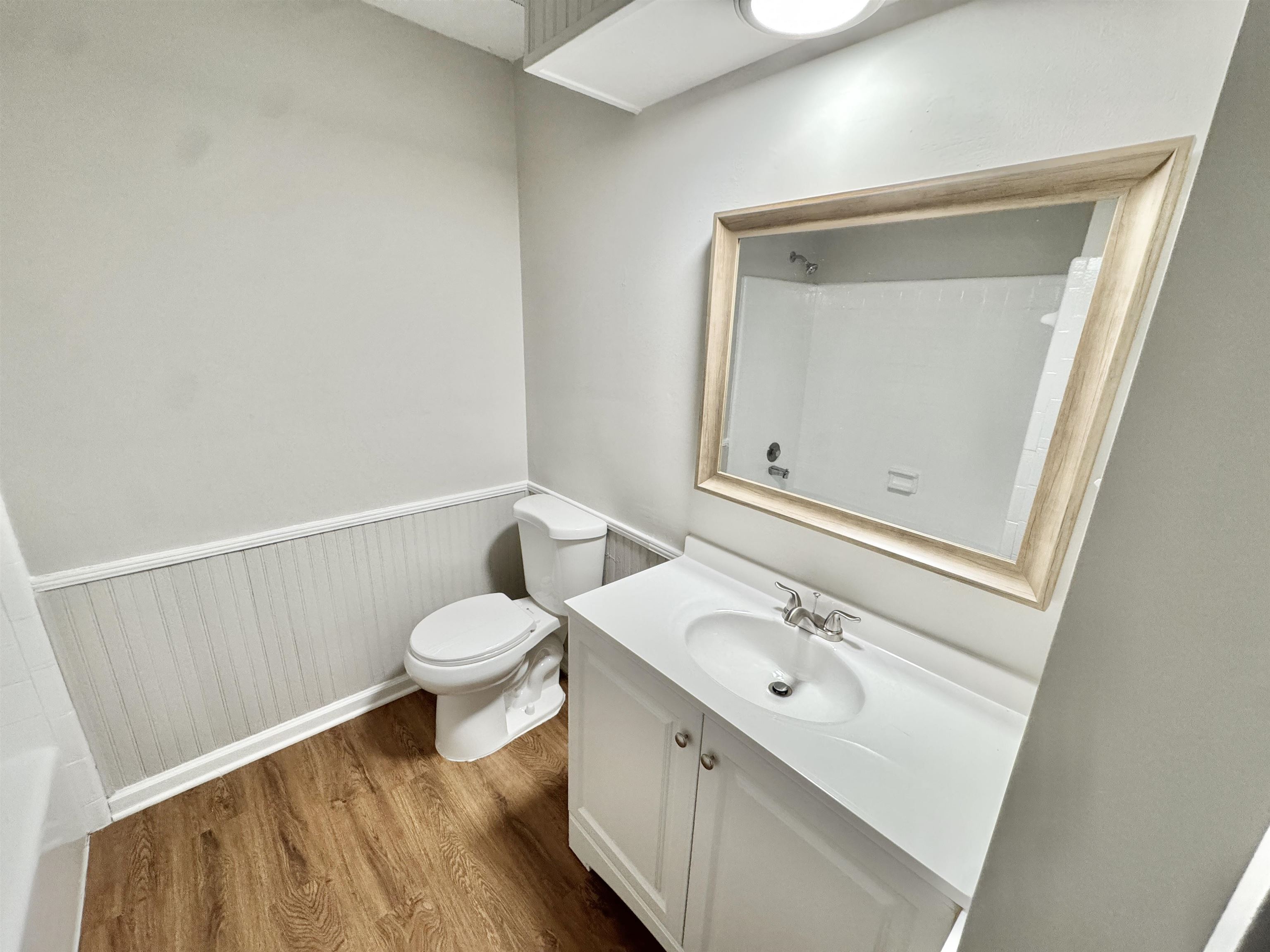 3334 Snow Ridge Cove Memphis, TN 38115 - Photo 26 of 38 a bathroom with a toilet a sink and mirror