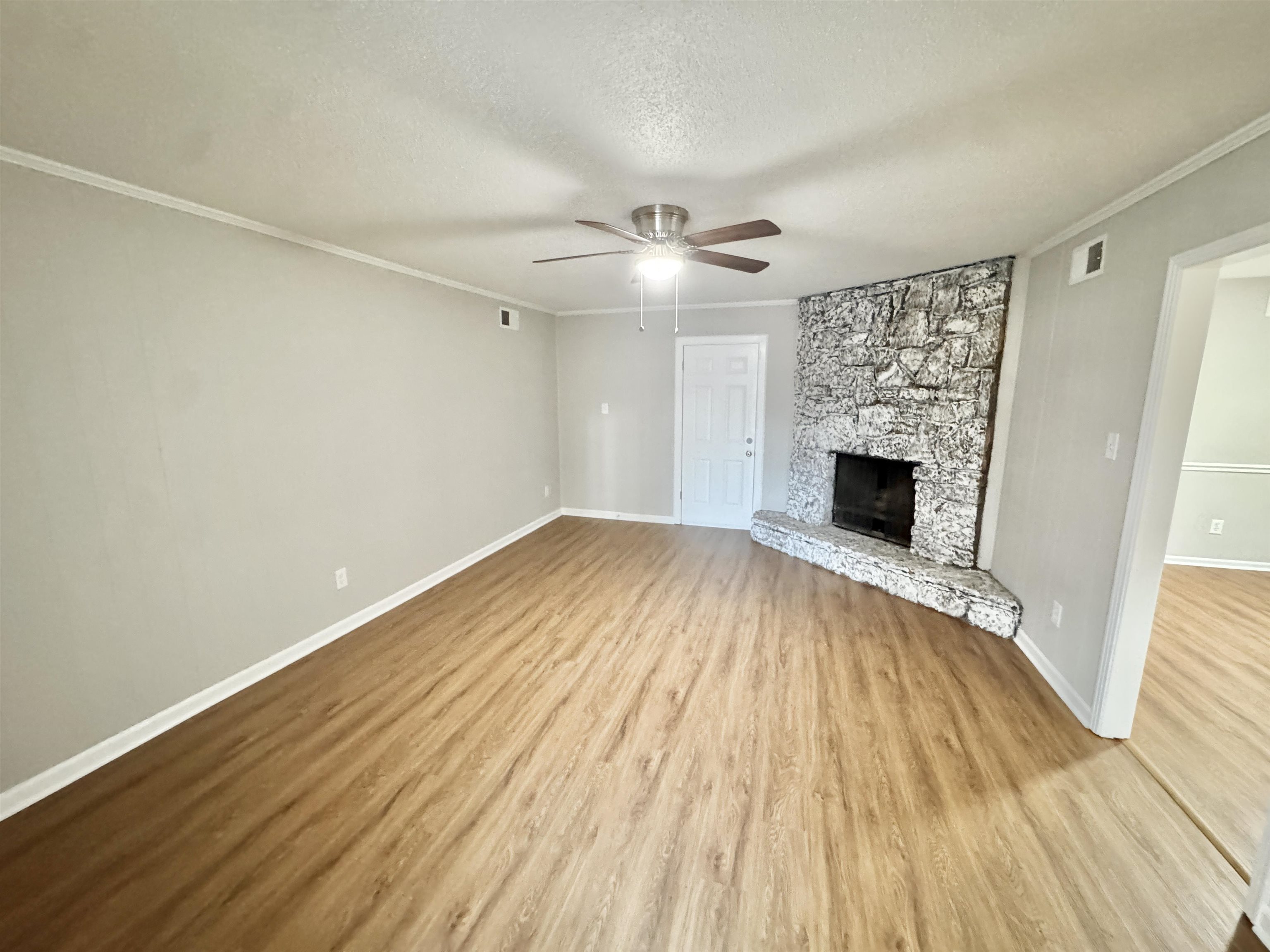 3334 Snow Ridge Cove Memphis, TN 38115 - Photo 5 of 38 a view of empty room with wooden floor and fan