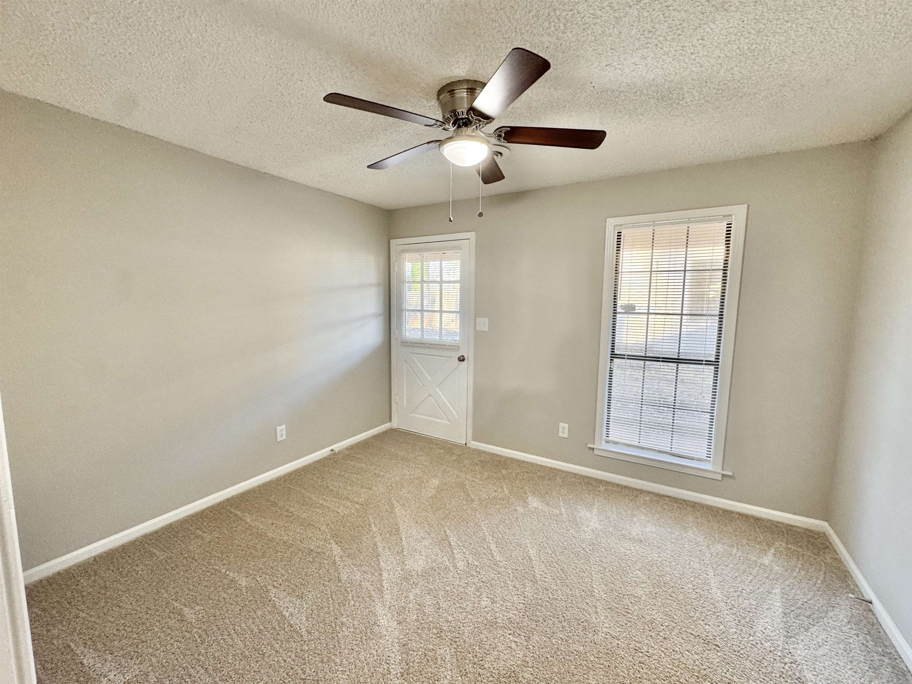 3334 Snow Ridge Cove Memphis, TN 38115 - Photo 7 of 38 a view of an empty room with a window