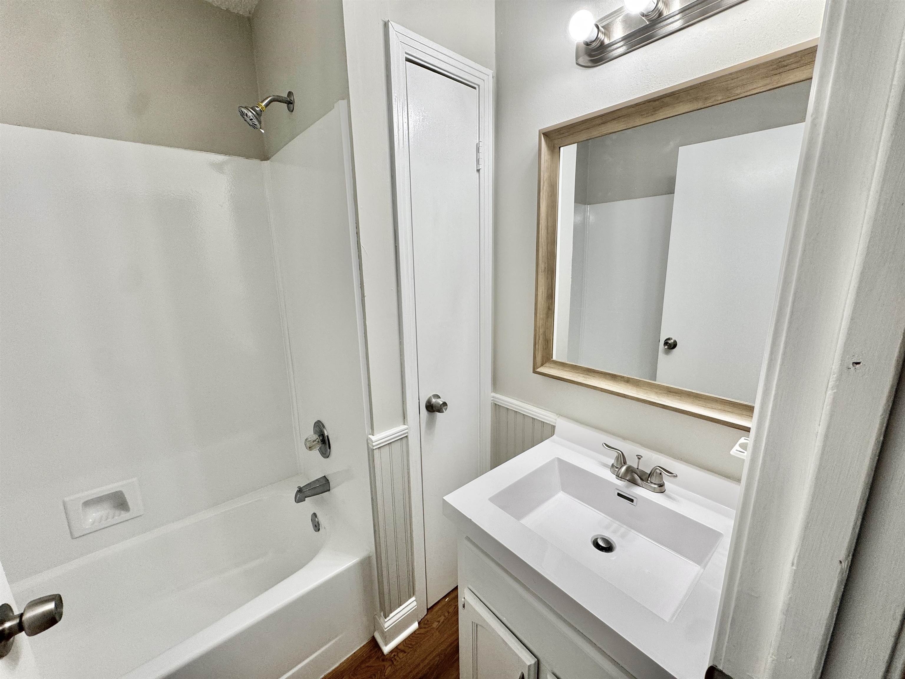 3334 Snow Ridge Cove Memphis, TN 38115 - Photo 9 of 38 a bathroom with a sink mirror and shower