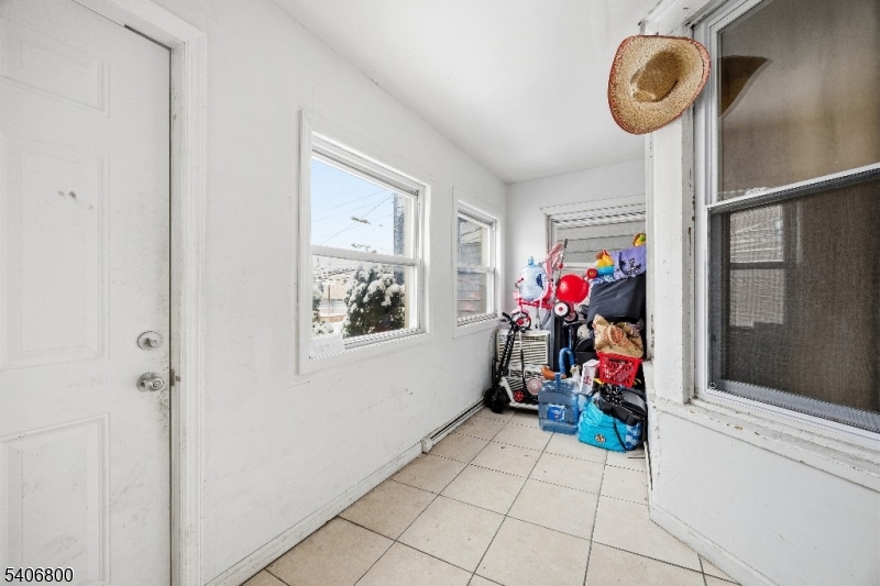 383 Broadway Passaic, NJ 07055 - Photo 3 of 11 a view of living room with furniture and flowers