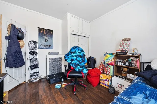 a play room with furniture and wooden floor