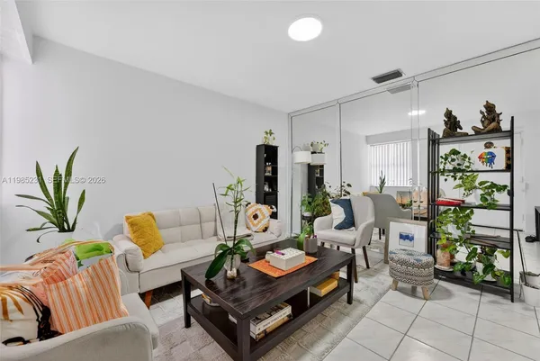 a living room with furniture and a rug