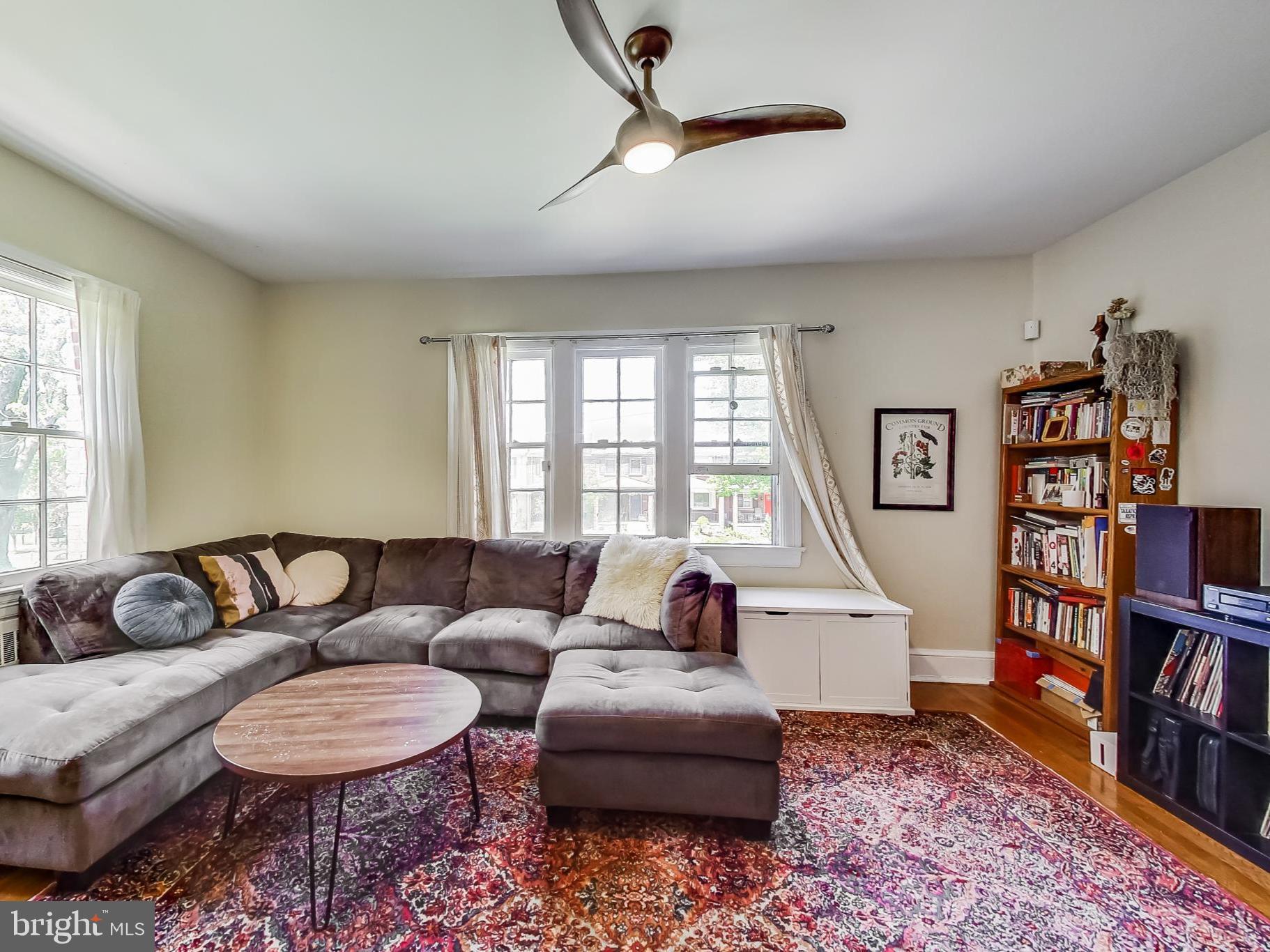236 Farragut Street Northwest, Unit 104 Washington, DC 20011 - Photo 1 of 27 a living room with furniture and a book shelf