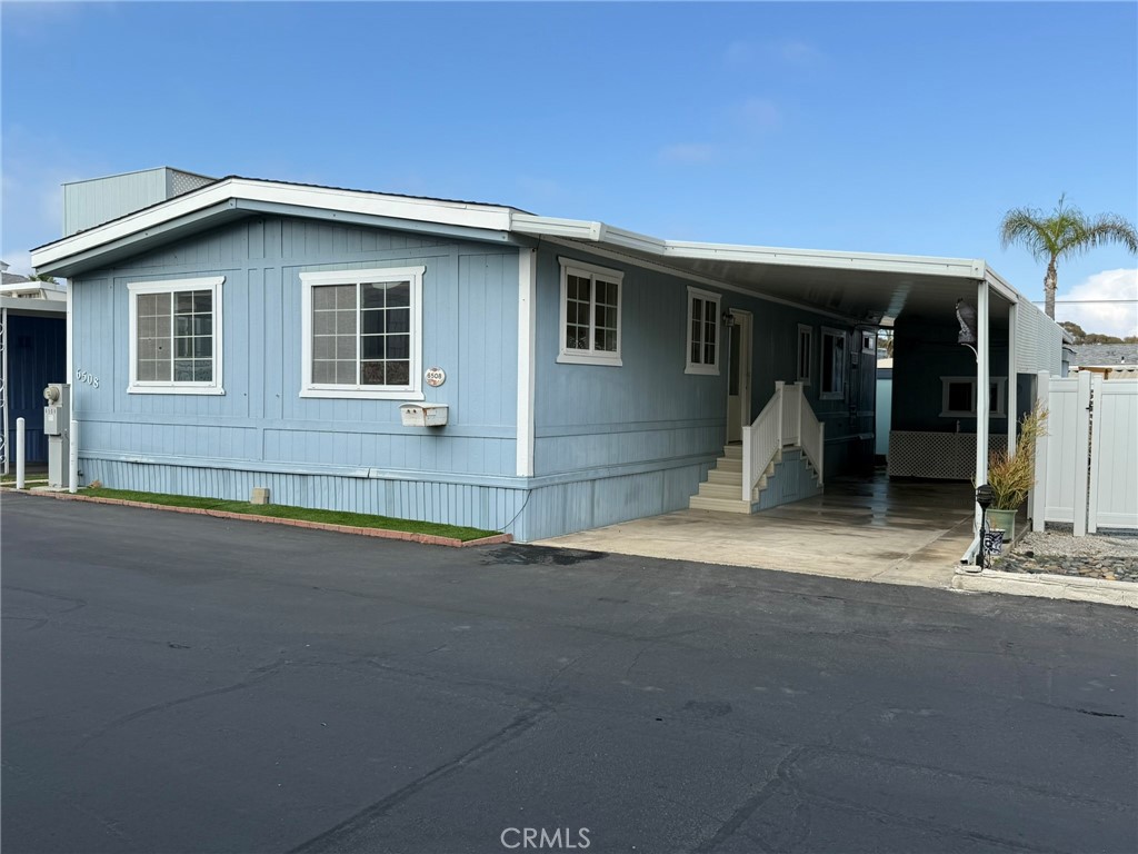 6508 Easy Street, Unit T Carlsbad, CA 92011 - Photo 1 of 19 a front view of a house with a garage