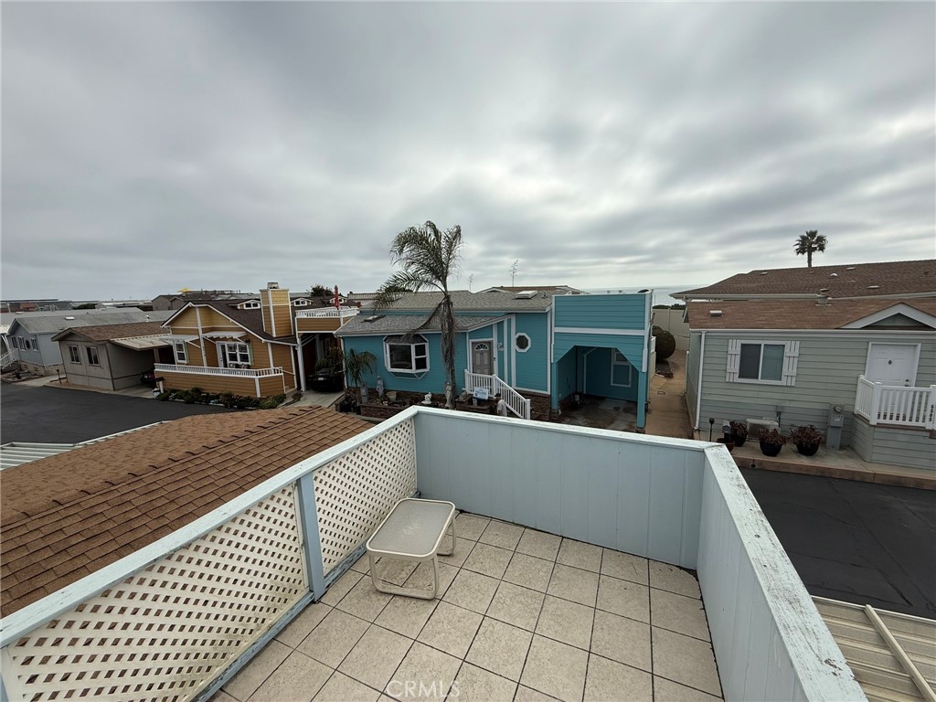6508 Easy Street, Unit T Carlsbad, CA 92011 - Photo 13 of 19 a front view of a house with a yard