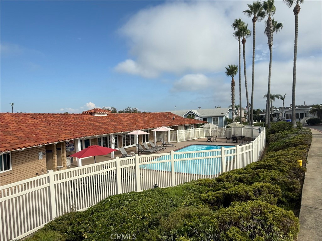 6508 Easy Street, Unit T Carlsbad, CA 92011 - Photo 17 of 19 a view of a white house with a ocean view