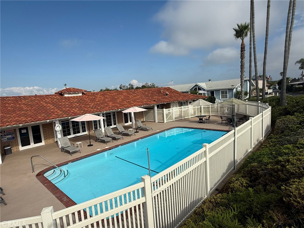 6508 Easy Street, Unit T Carlsbad, CA 92011 - Photo 18 of 19 a view of a house with wooden deck and furniture