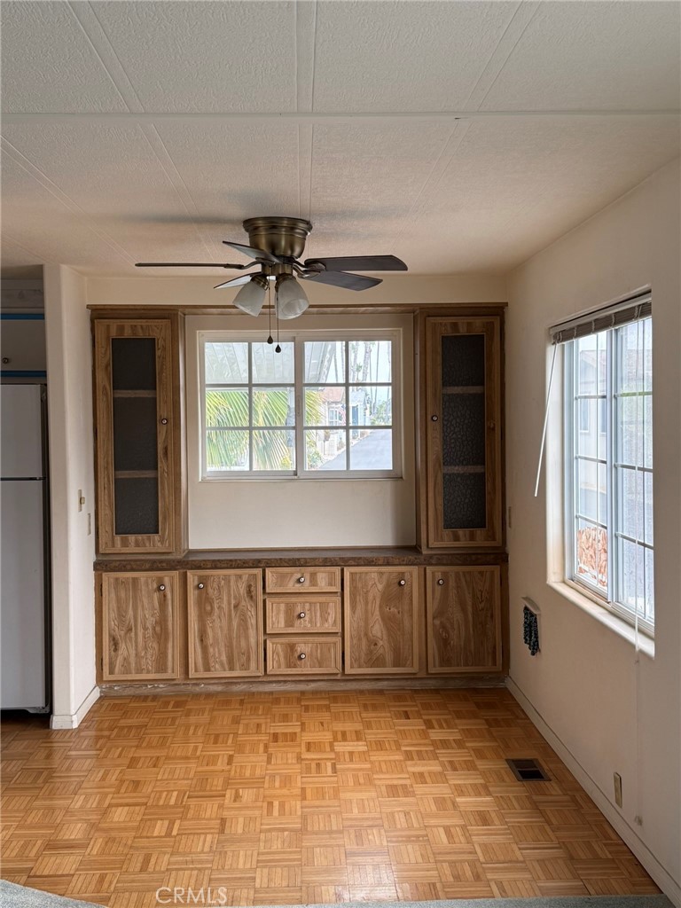 6508 Easy Street, Unit T Carlsbad, CA 92011 - Photo 7 of 19 an empty room with windows