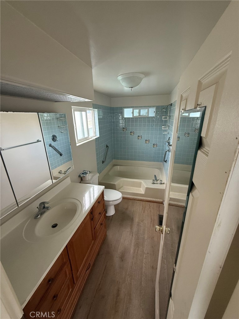 6508 Easy Street, Unit T Carlsbad, CA 92011 - Photo 10 of 19 a bathroom with a tub sink and mirror