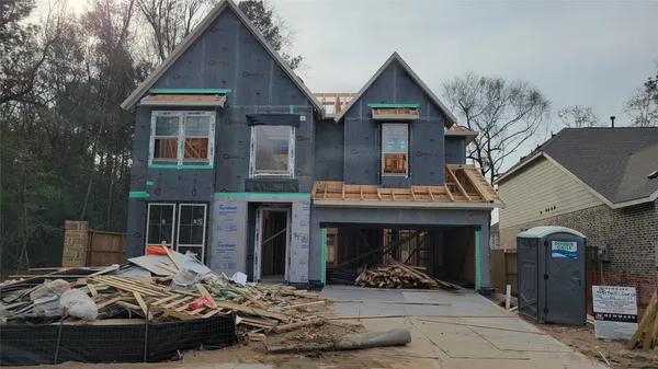 a front view of a house with sitting area