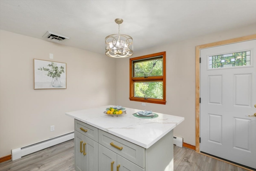 270 Lowell Street Wakefield, MA 01880 - Photo 16 of 41 a view of a dining room with a table and chairs