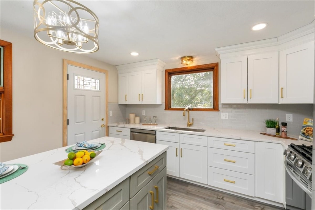 270 Lowell Street Wakefield, MA 01880 - Photo 17 of 41 a kitchen with a sink cabinets and window