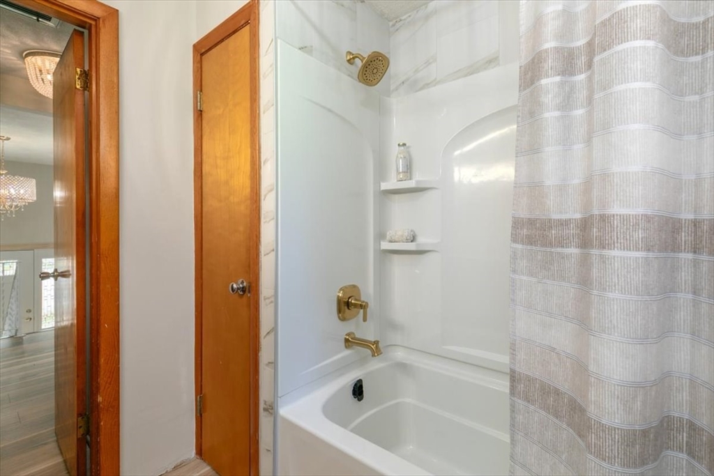 270 Lowell Street Wakefield, MA 01880 - Photo 24 of 41 a bathroom with a bathtub