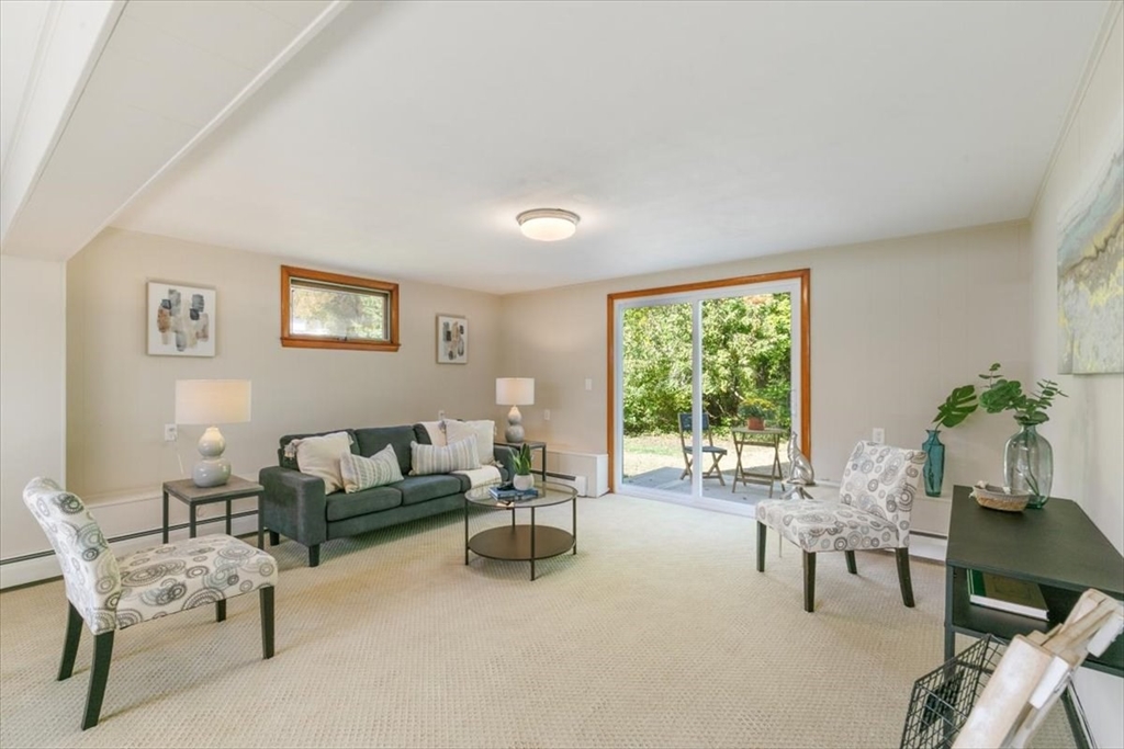 270 Lowell Street Wakefield, MA 01880 - Photo 28 of 41 a living room with furniture and a large window