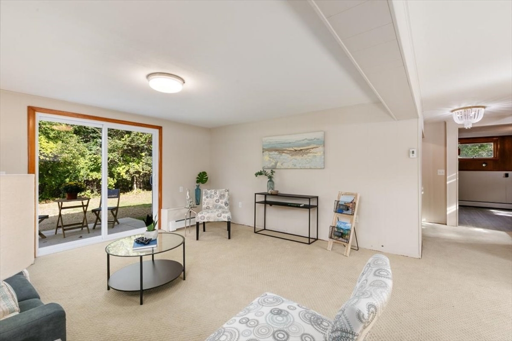 270 Lowell Street Wakefield, MA 01880 - Photo 29 of 41 a living room with furniture and a large window