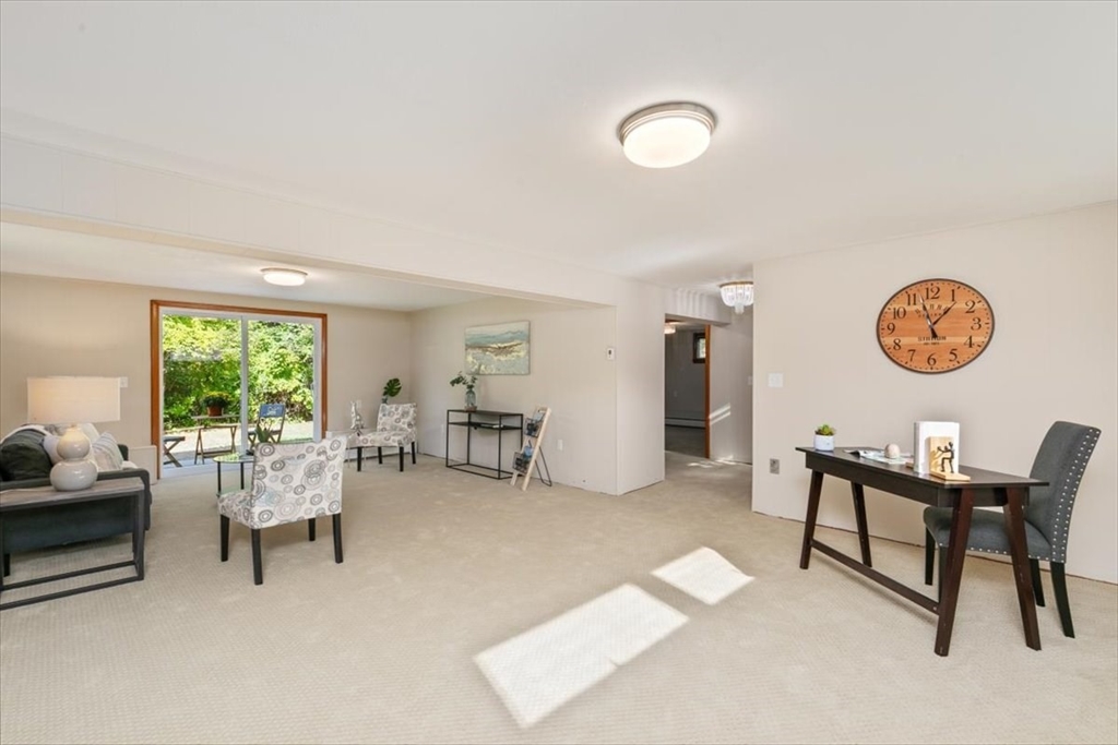 270 Lowell Street Wakefield, MA 01880 - Photo 30 of 41 a living room with furniture and a large window