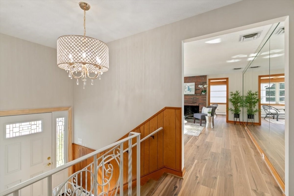 270 Lowell Street Wakefield, MA 01880 - Photo 8 of 41 a view of a livingroom with wooden floor and furniture