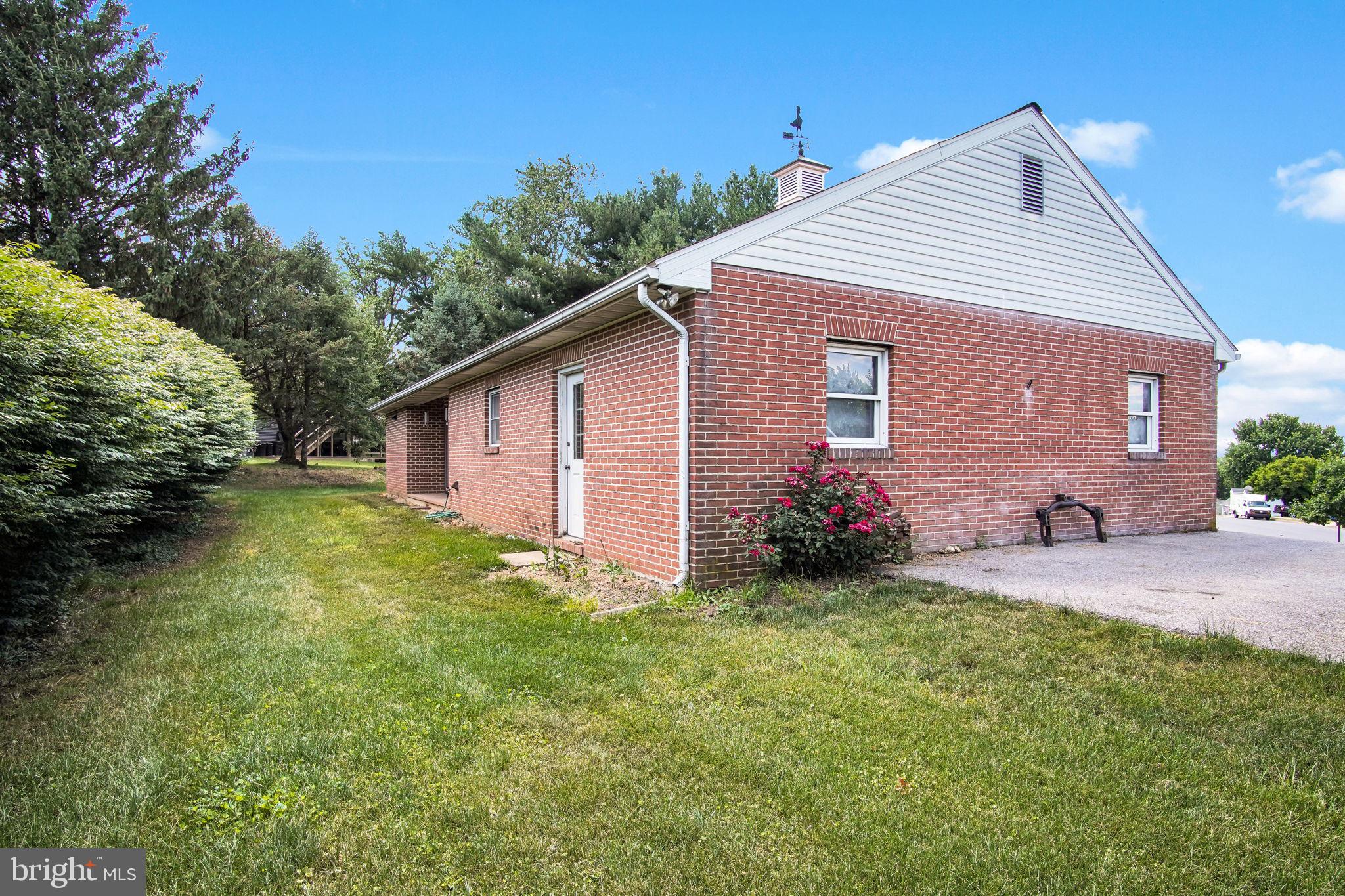 814 South Cedar Street Lititz, PA 17543 - Photo 13 of 53 Charming brick home with lush greenery.