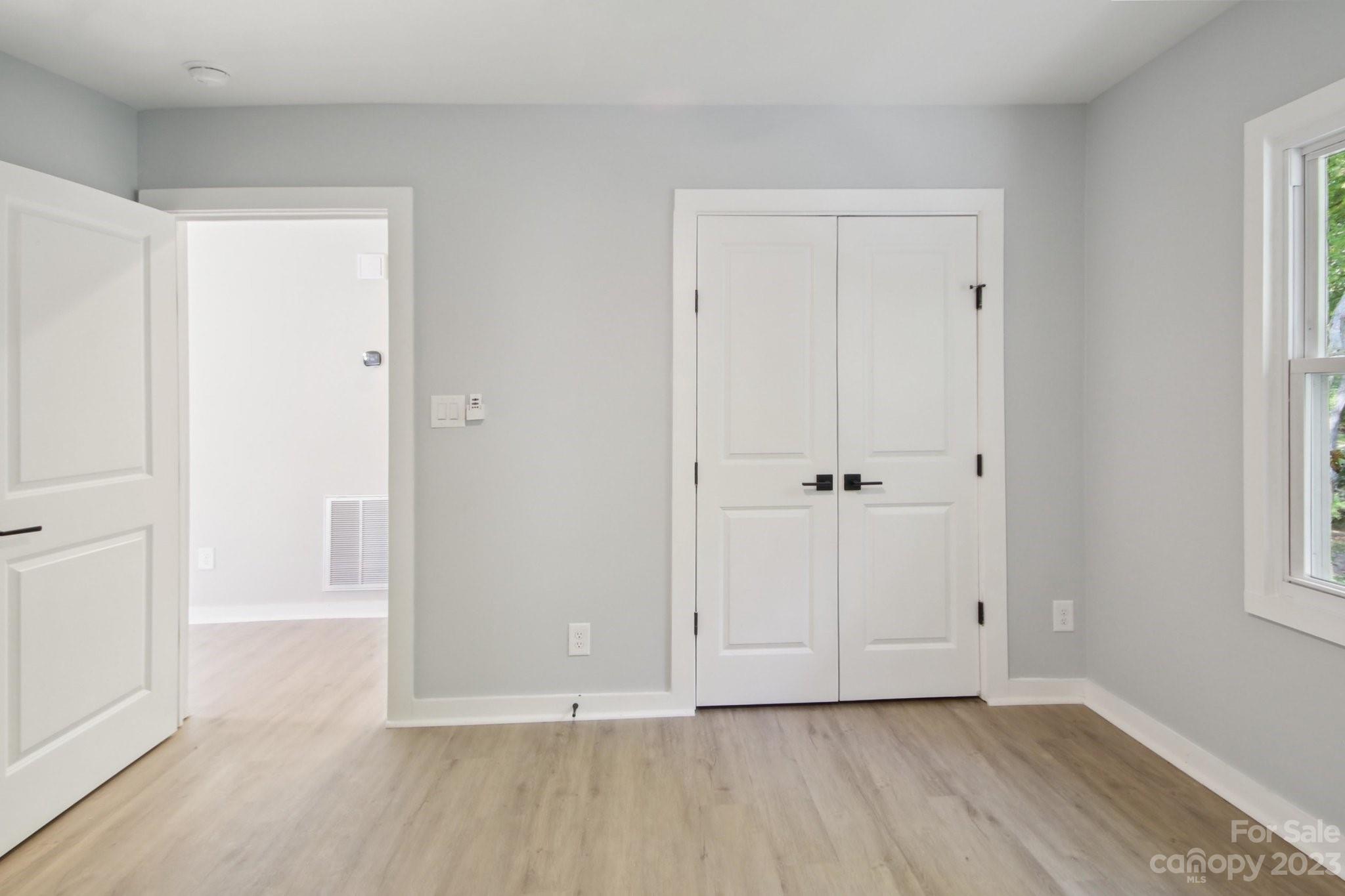 5225 Farmbrook Drive Charlotte, NC 28210 - Photo 11 of 18 a view of an empty room with wooden floor