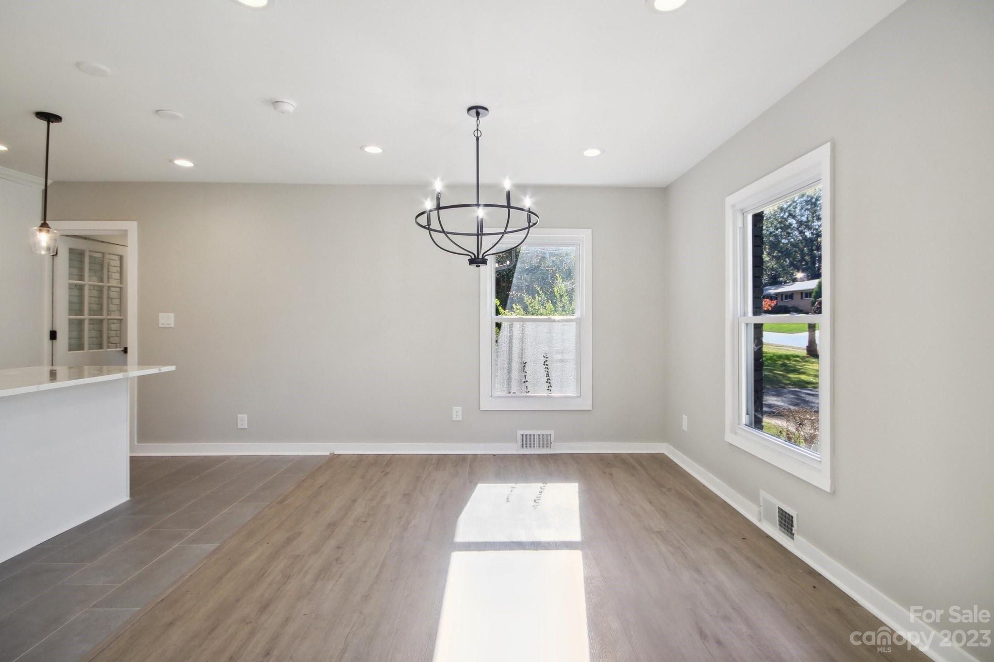 5225 Farmbrook Drive Charlotte, NC 28210 - Photo 4 of 18 a view of empty room with wooden floor and window